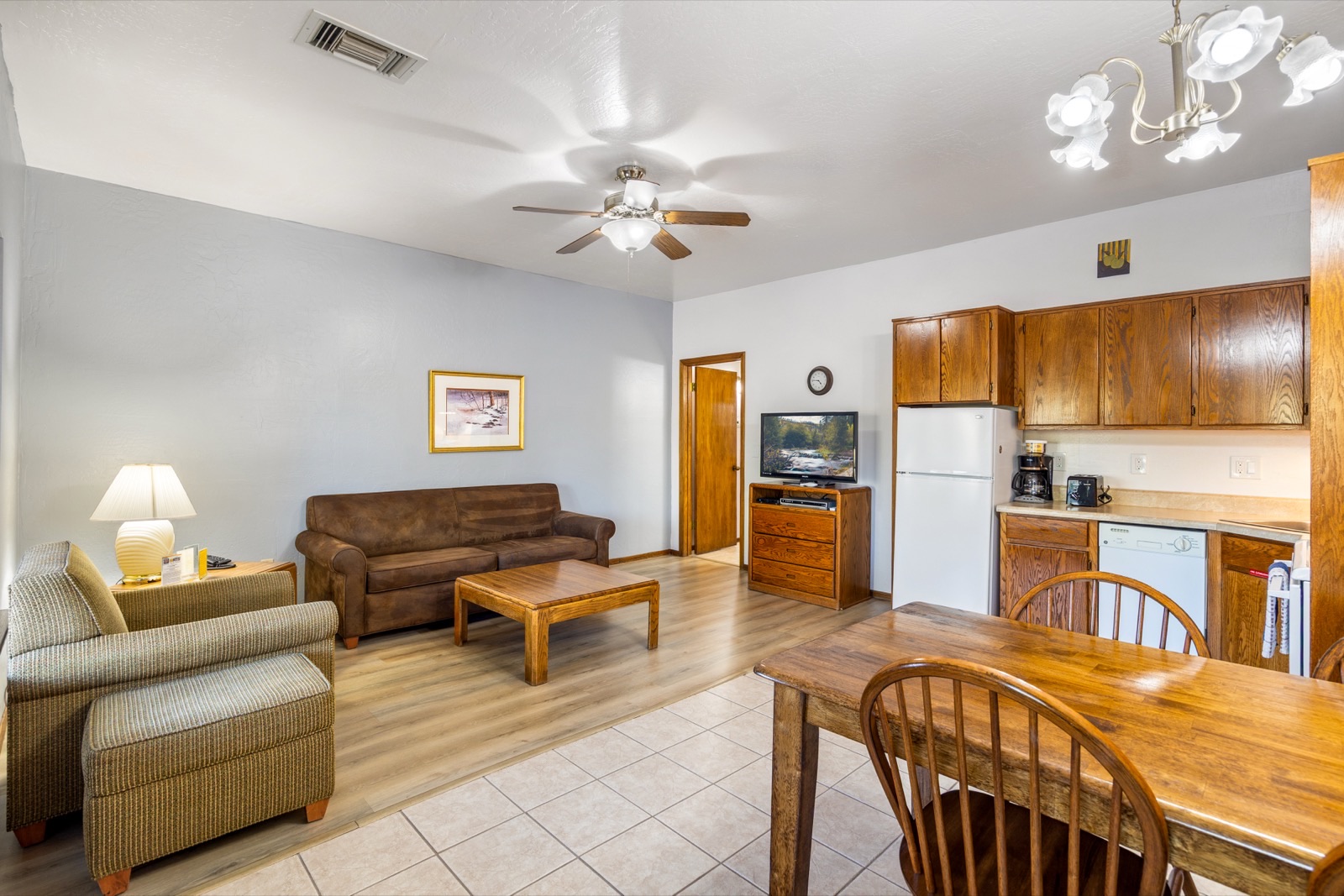 One bedroom apartment with open living area, dining, and kitchen